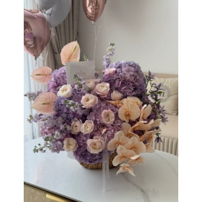 Bouquet of flowers Peach-purple love in a basket