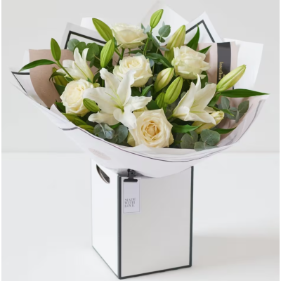 Beautiful bouquet of white roses and lilies